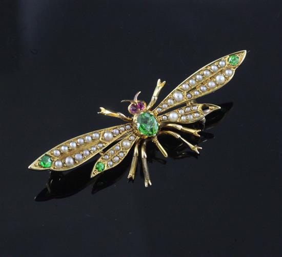 An early 20th century gold, demantoid garnet and seed pearl set bug brooch, 46mm.